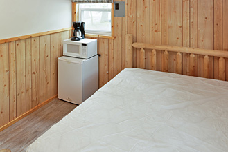 Deluxe Cabin Queen Bed at Dogwood Acres Campground